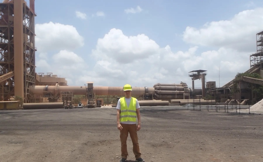 Morten Jensen in front of a rotary kiln at a cement plant